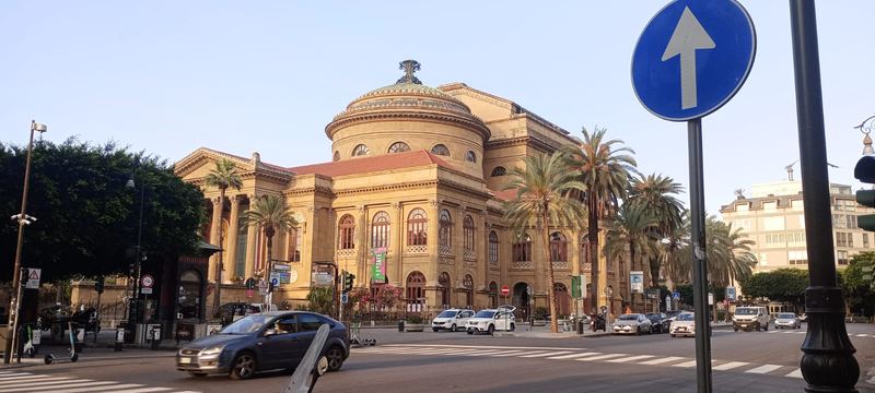 The Teatro Massimo opera house in Palermo, framed by palm trees