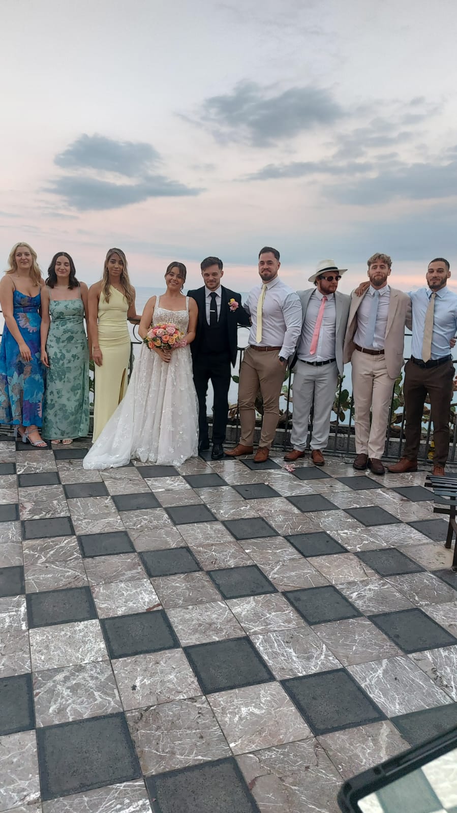 Wedding guests celebrating on a sea-view terrace in Taormina