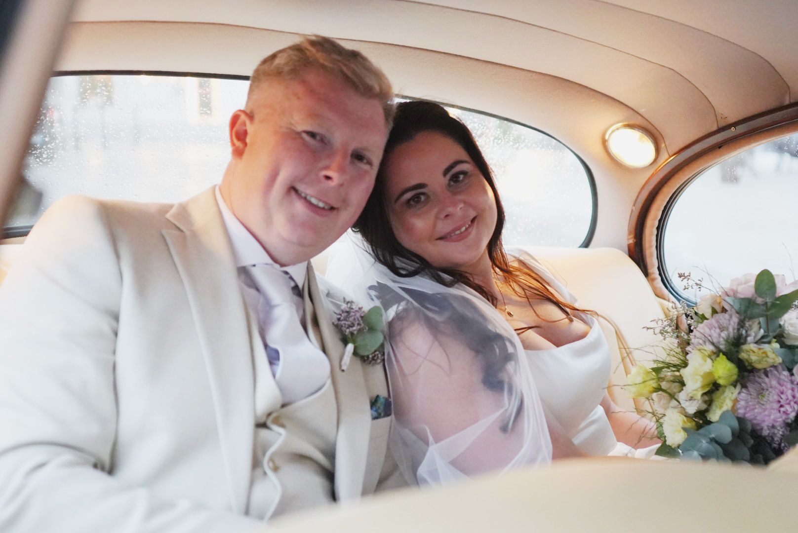 Bride inside a vintage wedding car in Sicily