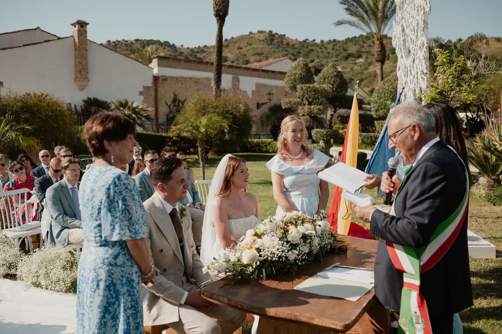 Sabina interpreting beside the Italian official during Jessica and Seb’s outdoor ceremony in Sicily