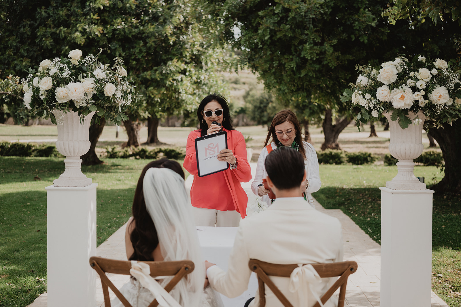 Our planner and the officiant at Lidia and Rian’s civil ceremony, the couple seated before them