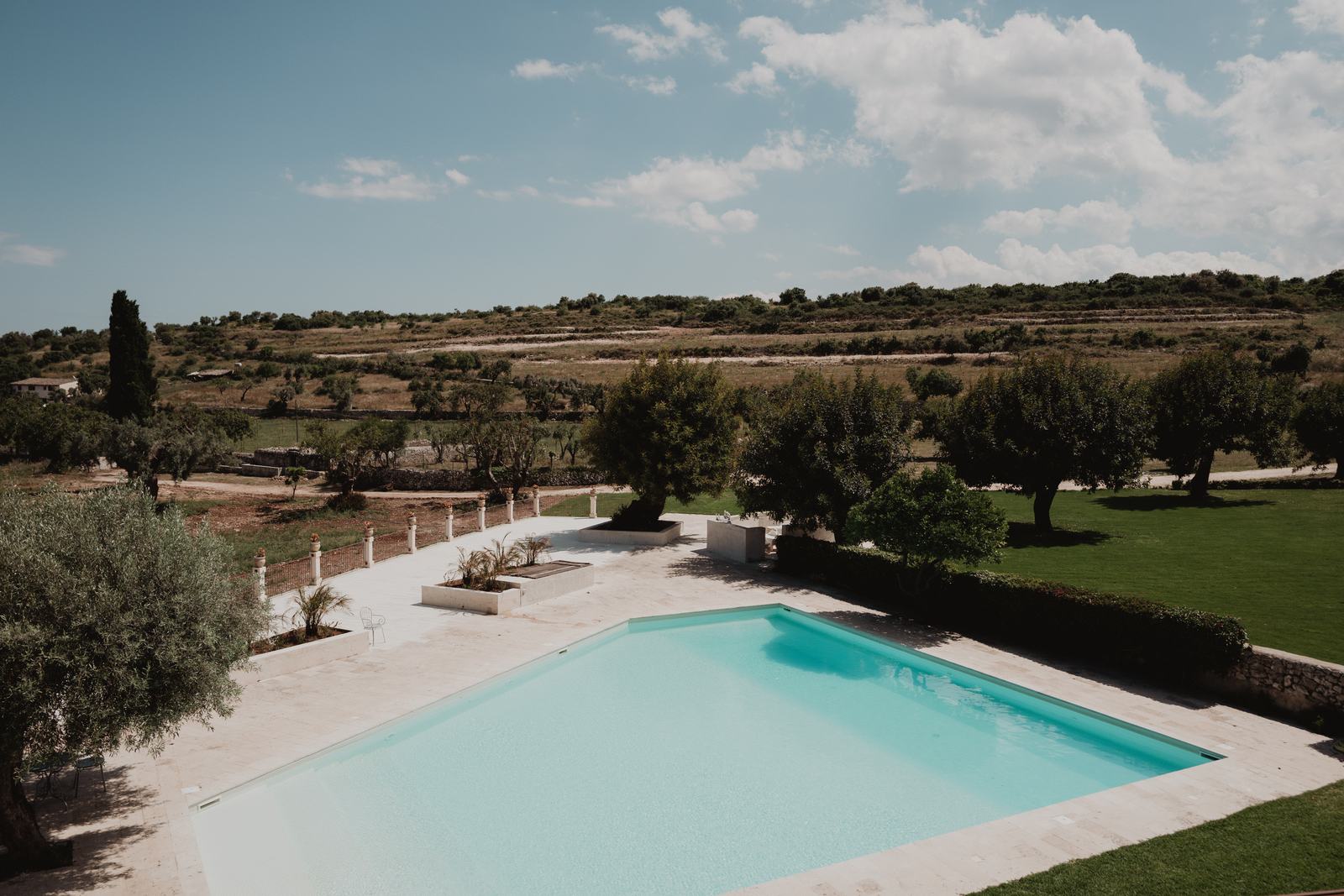 The swimming pool at Borgo del Carato, looking out over open Sicilian countryside