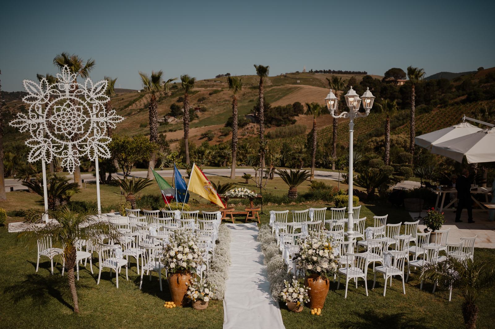 A ceremony set up in the garden at Casale degli Aranci, a countryside wedding venue near Castellammare del Golfo