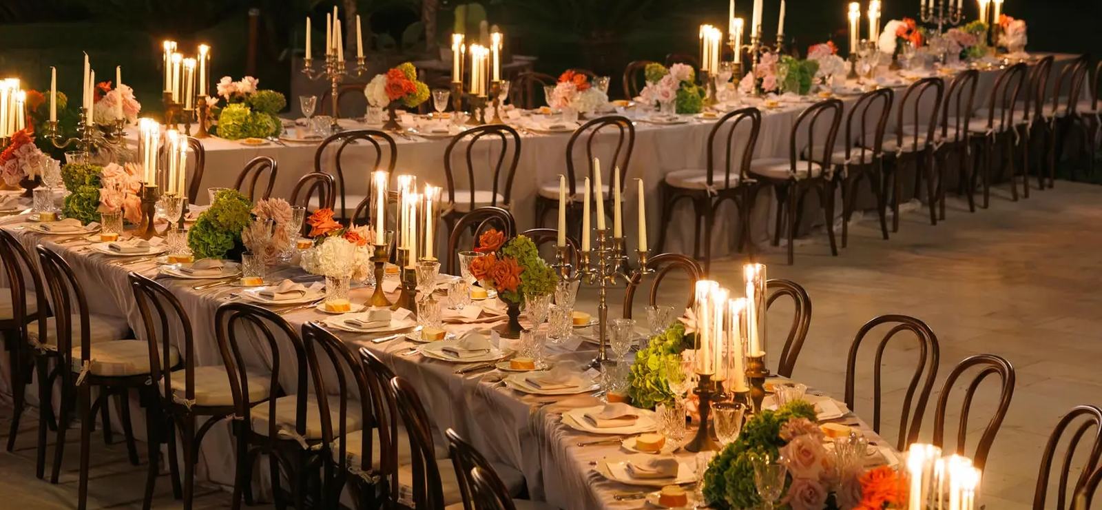 A long candlelit wedding table with flowers at Dimora delle Balze, Sicily