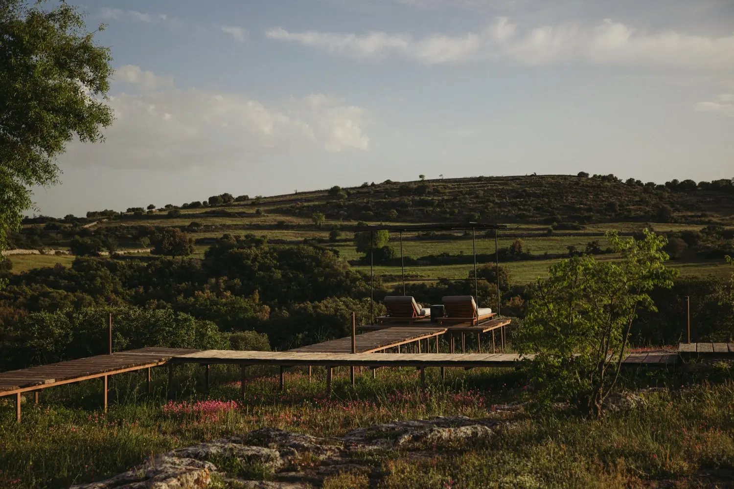 View from the estate over the green Val di Noto and the Manghisi valley at Dimora delle Balze
