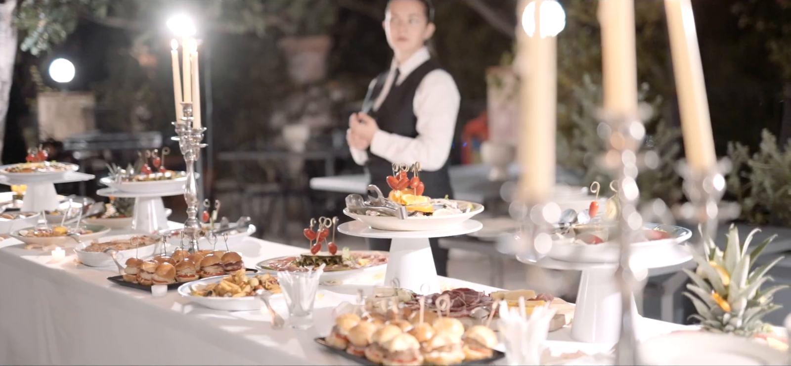 A candlelit buffet of Sicilian food at a wedding reception at the Excelsior Palace, Taormina
